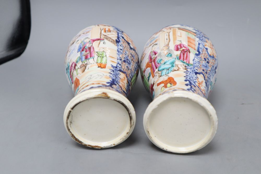 A pair of 18th century Chinese famille rose figural vases, height 25.5cm